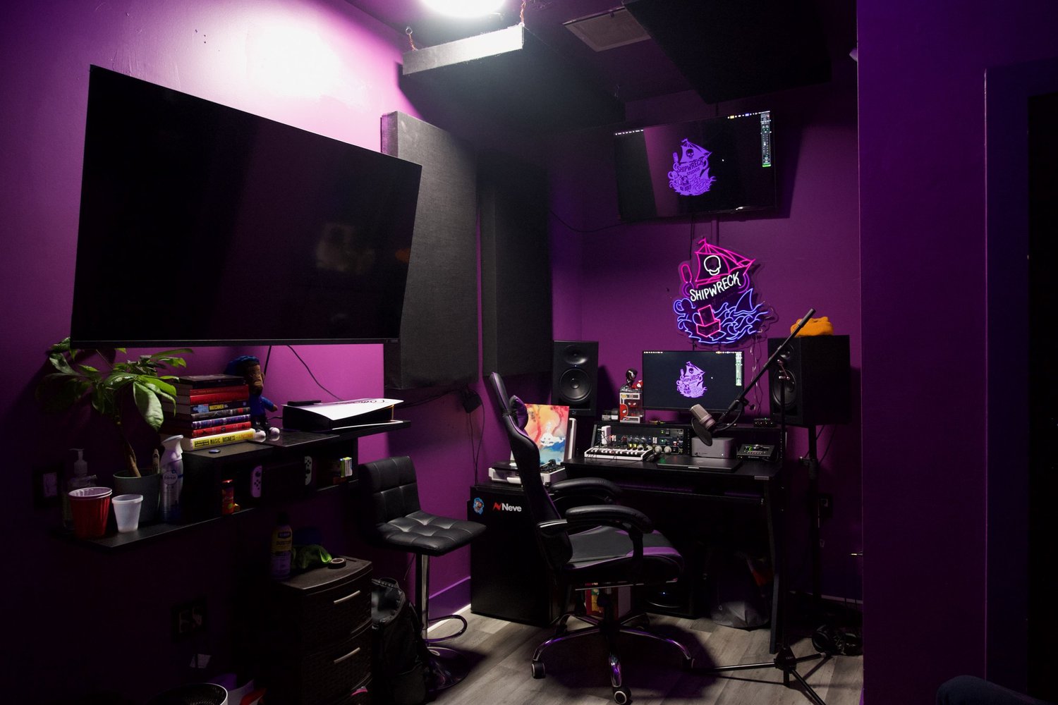 The Shipwreck recording room with purple walls, console and microphones